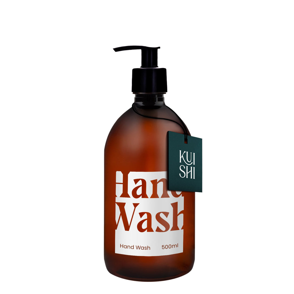 Brown bottle of hand wash with a pump and 'Kushi' label on a white background