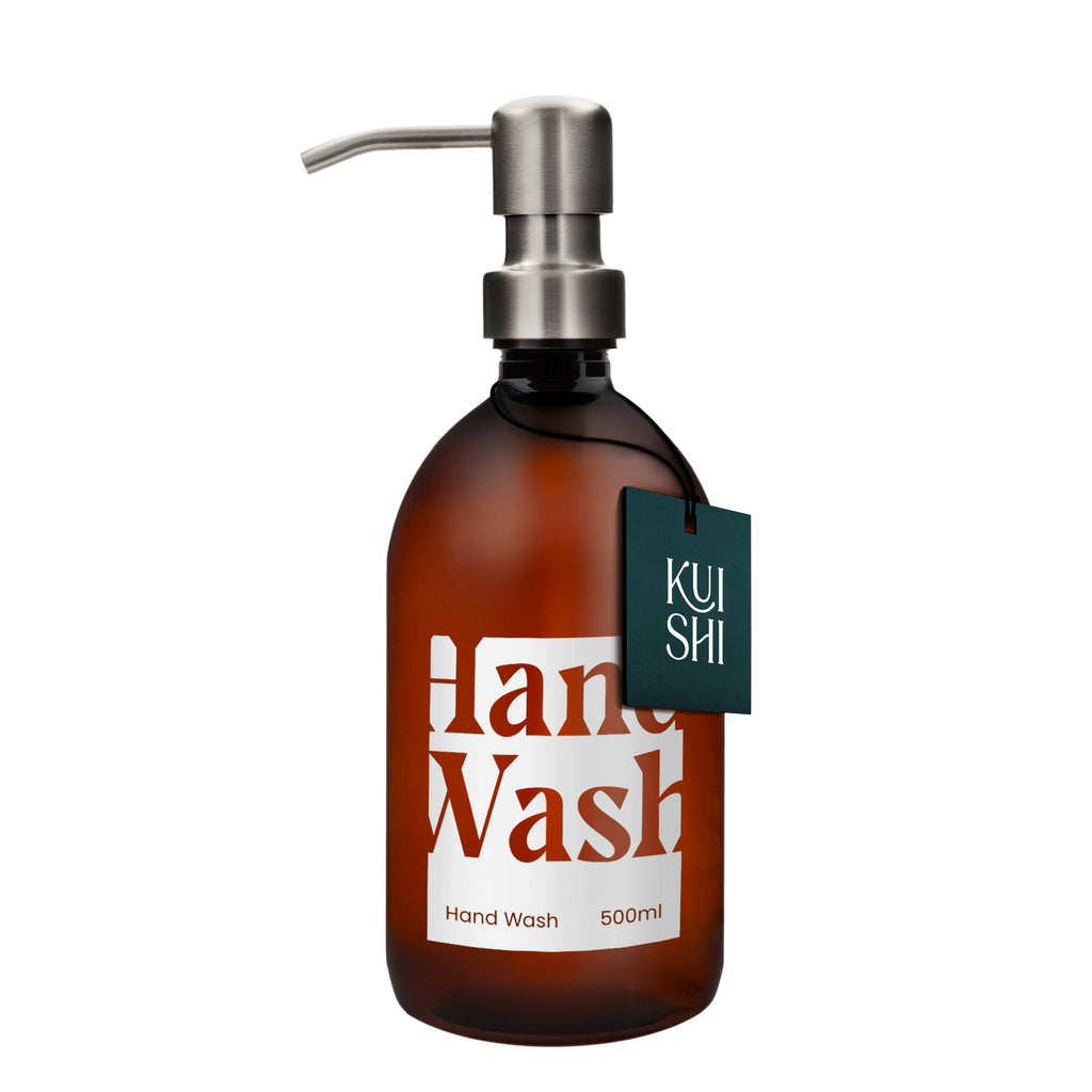 Brown bottle of hand wash with pump and 'Kushi' label on a white background