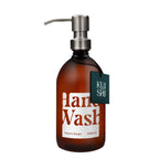 Brown bottle of hand wash with pump and 'Kushi' label on a white background