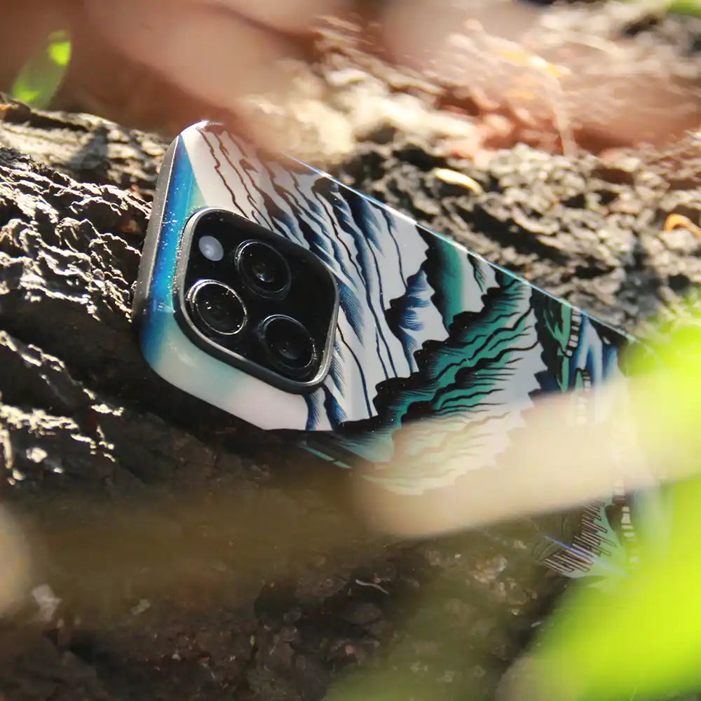 Japanese Mountain Print Tough Case for iPhone 16 Pro Max with mountain landscape design on a nature, tree, leaves background and foreground.