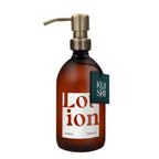 Brown lotion bottle with pump and 'KUSHI' label on a white background