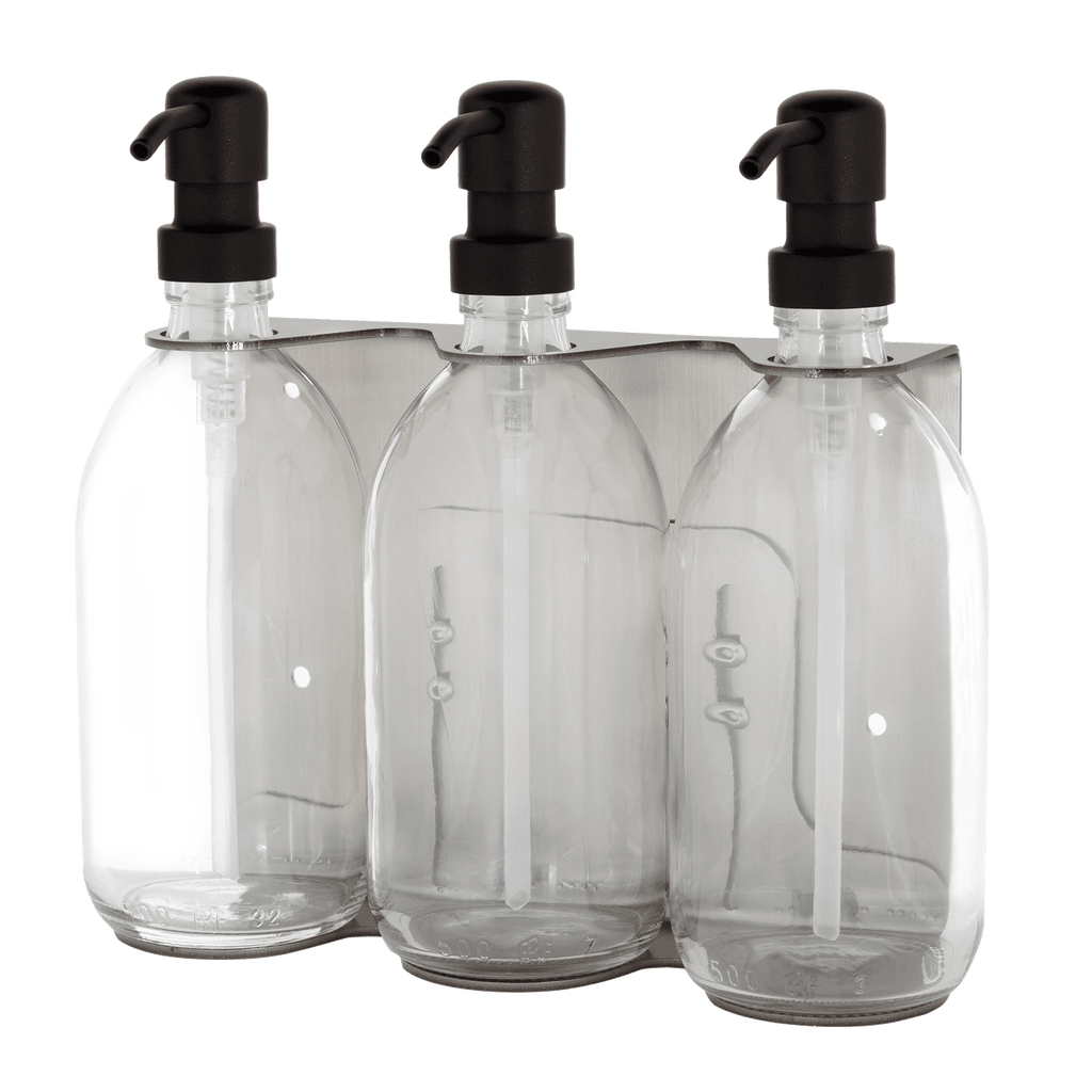 Three clear plastic bottles with black pump dispensers in a transparent packaging.