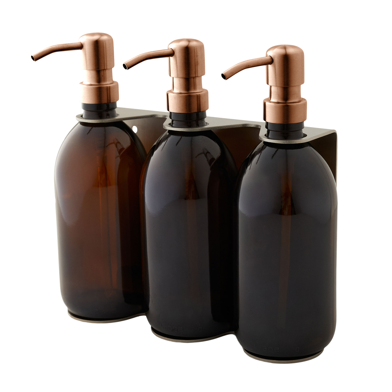 Three dark glass bottles with copper pumps in a holder on a white background