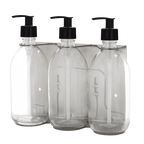 Three clear plastic bottles with black pump dispensers on a transparent background
