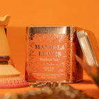 Mandala Leaves Rooibos Tea canister with decorative design on an orange background