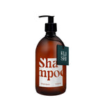 Brown shampoo bottle with pump and 'Kushi' label on a white background