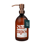 Brown shampoo bottle with pump and 'Kushi' label on a white background