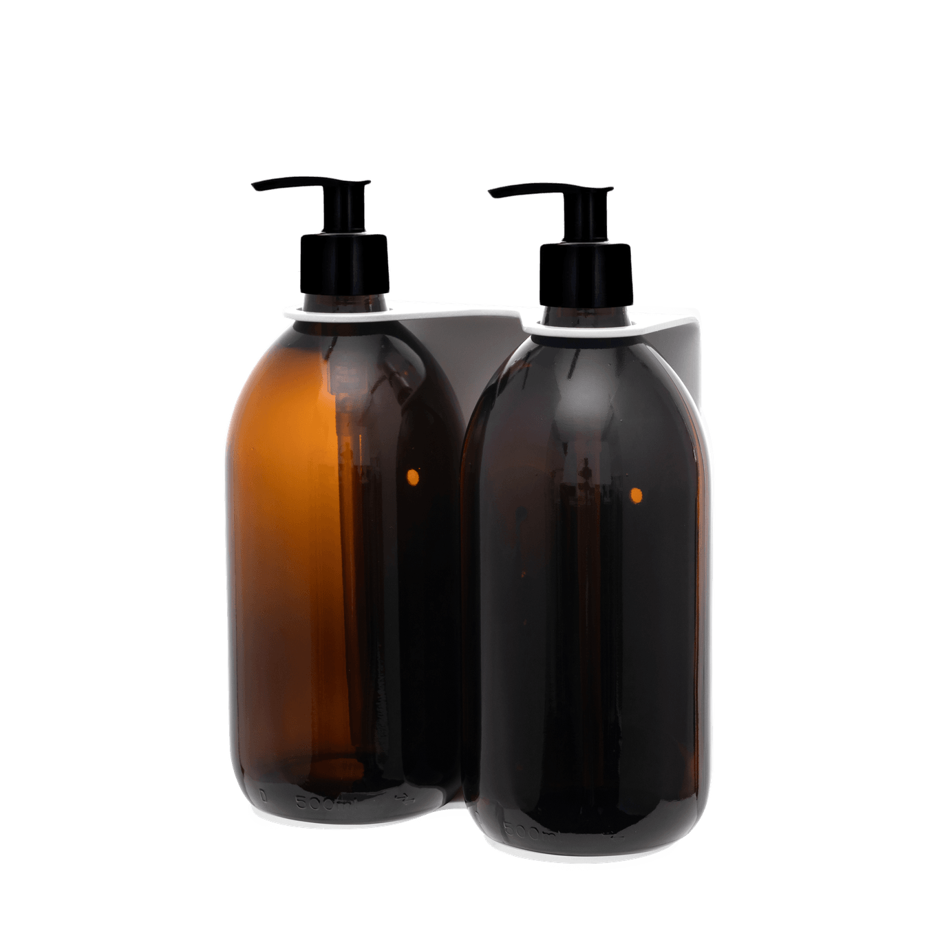 Two brown bottles with black pumps in a white holder on a transparent background