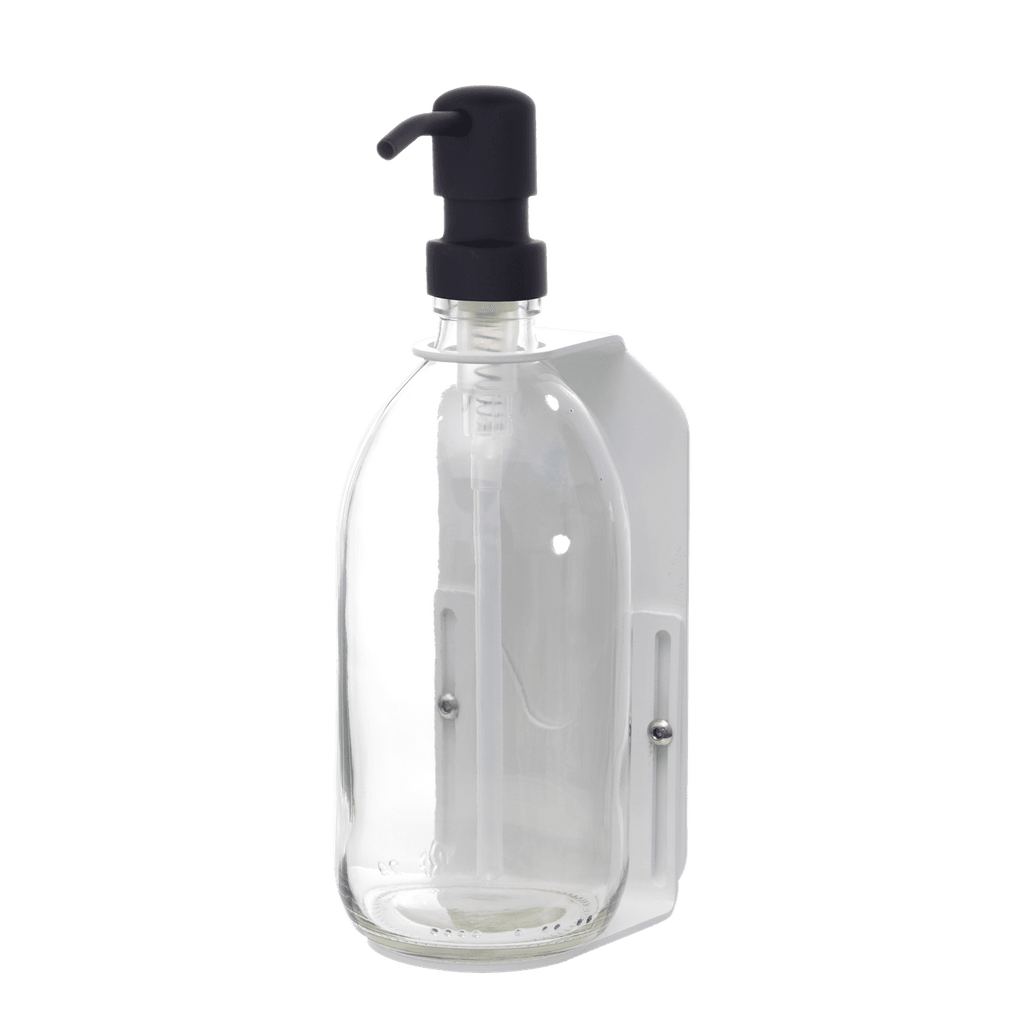 Clear plastic bottle with black pump dispenser on a dark gray background