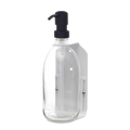 Clear plastic bottle with black pump dispenser on a dark gray background