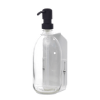 Clear plastic bottle with black pump dispenser on a dark gray background