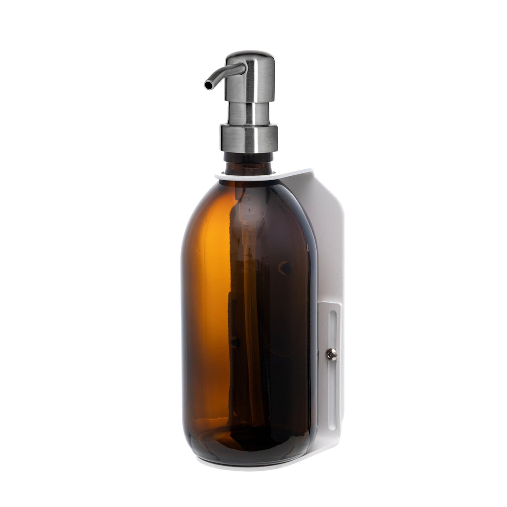 Brown glass bottle with silver pump on a white background