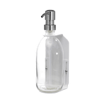 Clear glass bottle with silver pump dispenser on a dark blue background