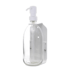 Clear plastic bottle with white pump on a dark gray background